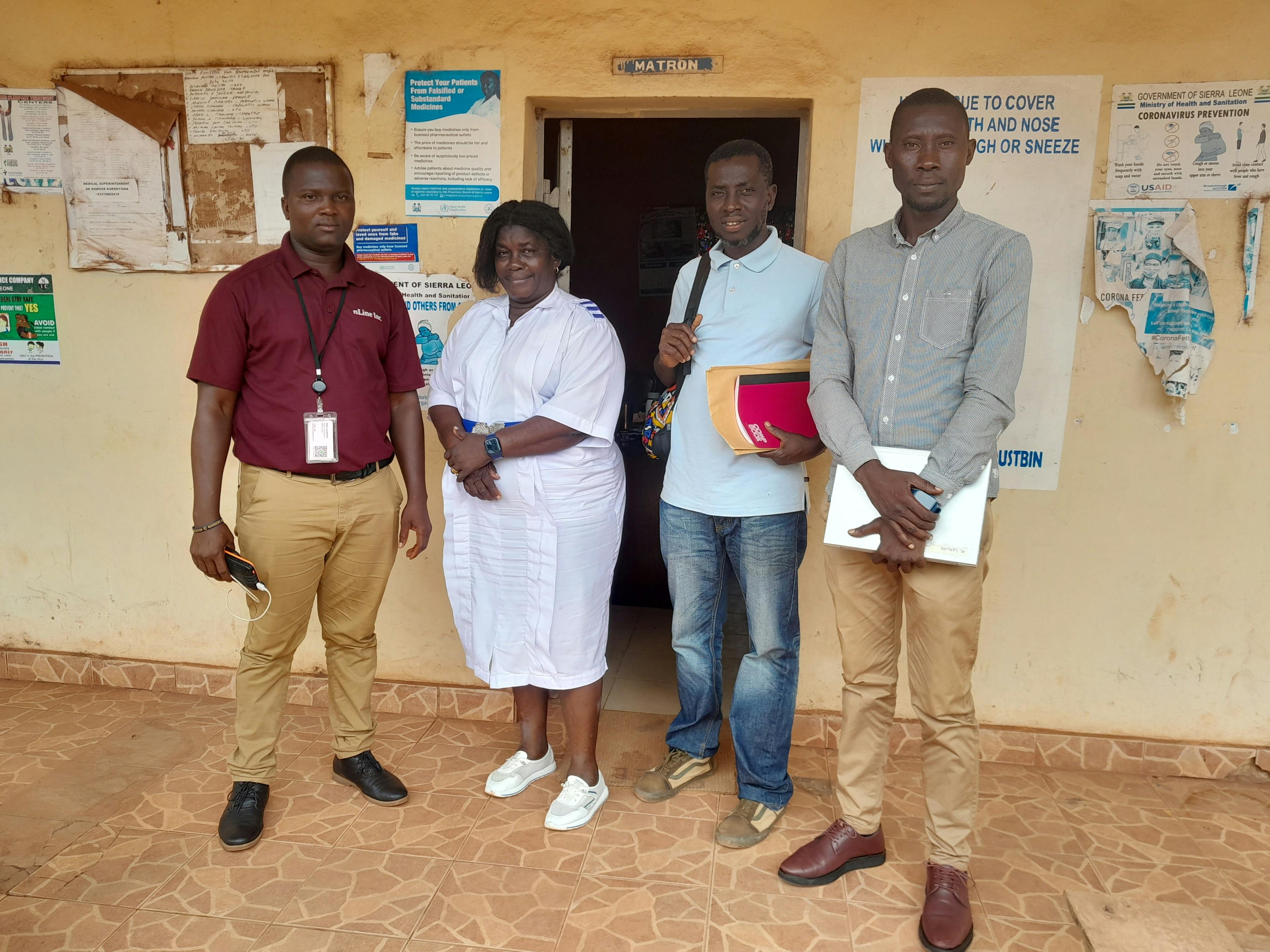 nLine (far left) and Crown Agent (far right) visit Kambia Government Hospital for energy audit assessments and sensor installation. In the center are the hospital’s Matron and Maintenance Officer.