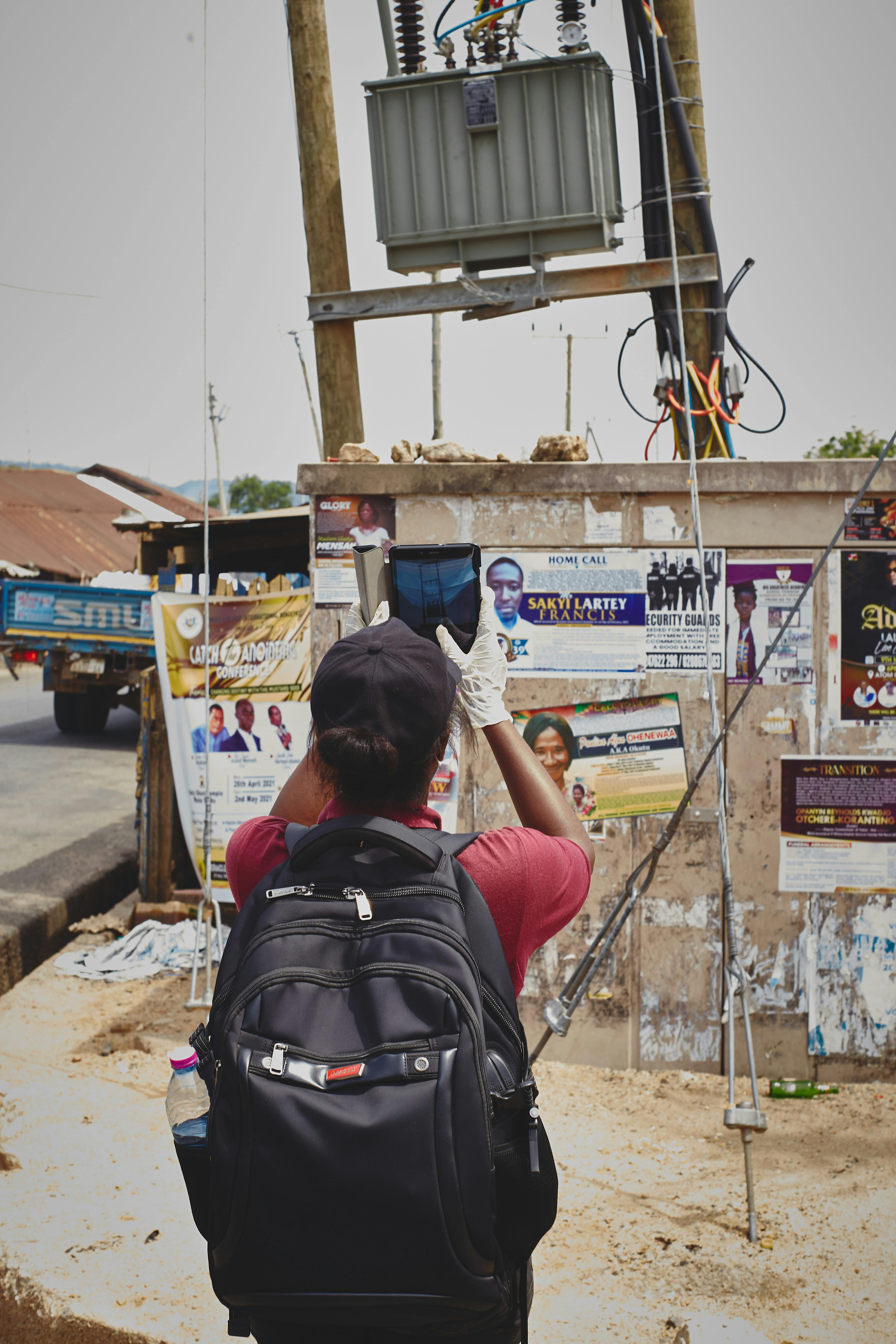 The field team conducting on-the-ground verification of transformer locations to inform the placement of sensors with grid-connected households and businesses.